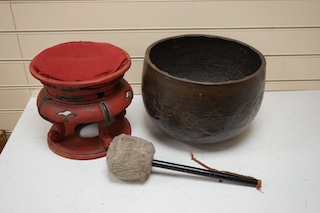 A large Japanese bronze temple bowl with beater, on red lacquered stand. Bowl 33cm diameter. Condition - fair to good